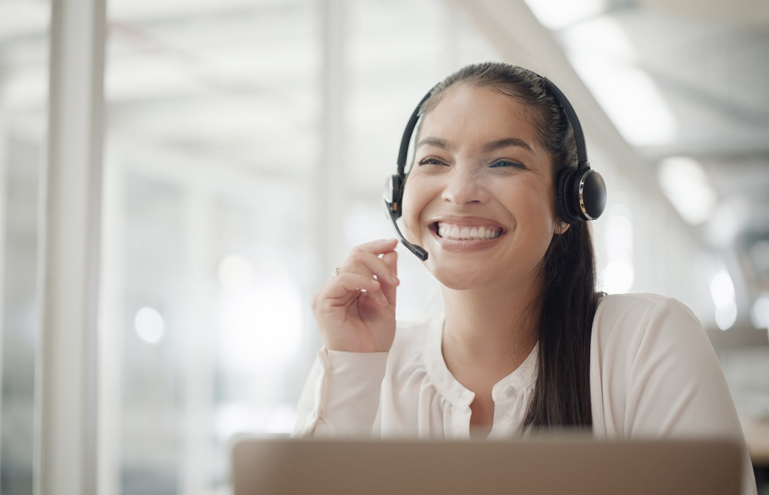 Smiling woman using a headset